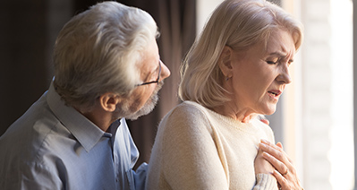 caregiver assisting senior woman on the tablet