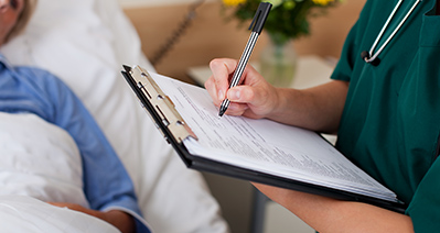 caregiver assisting senior woman on the tablet