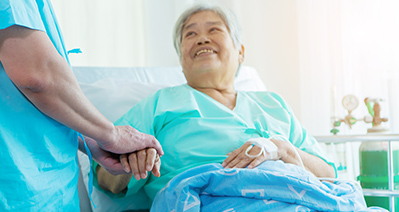 caregiver assisting senior woman on the tablet